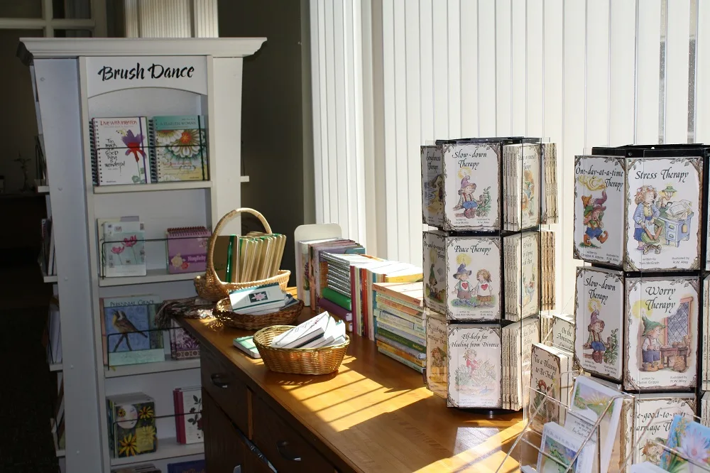 racks of cards and other gift items available for sale at a spiritual retreat center bookstore